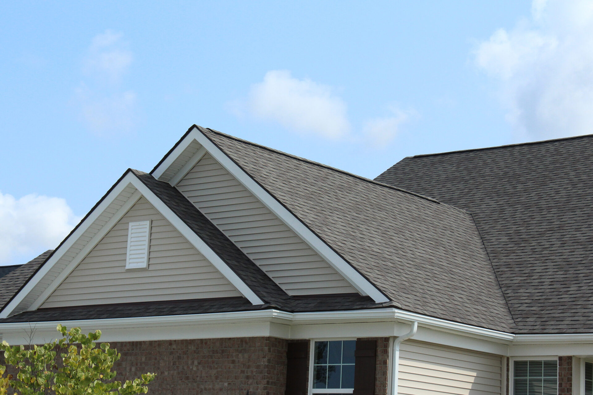 Roof of a house with grey shingles