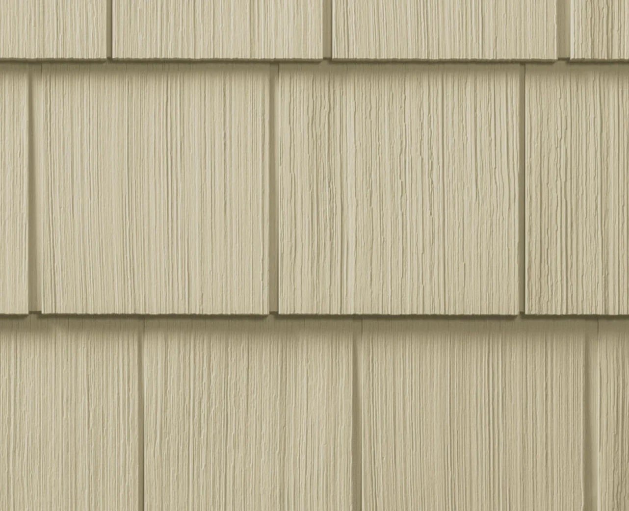Tan colored siding panels on a house exterior Tan siding panels. Exterior house siding.