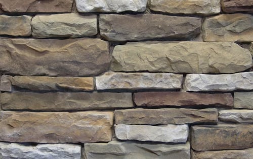 Brown and gray stone wall background Brown and gray stone wall. Natural stone texture.
