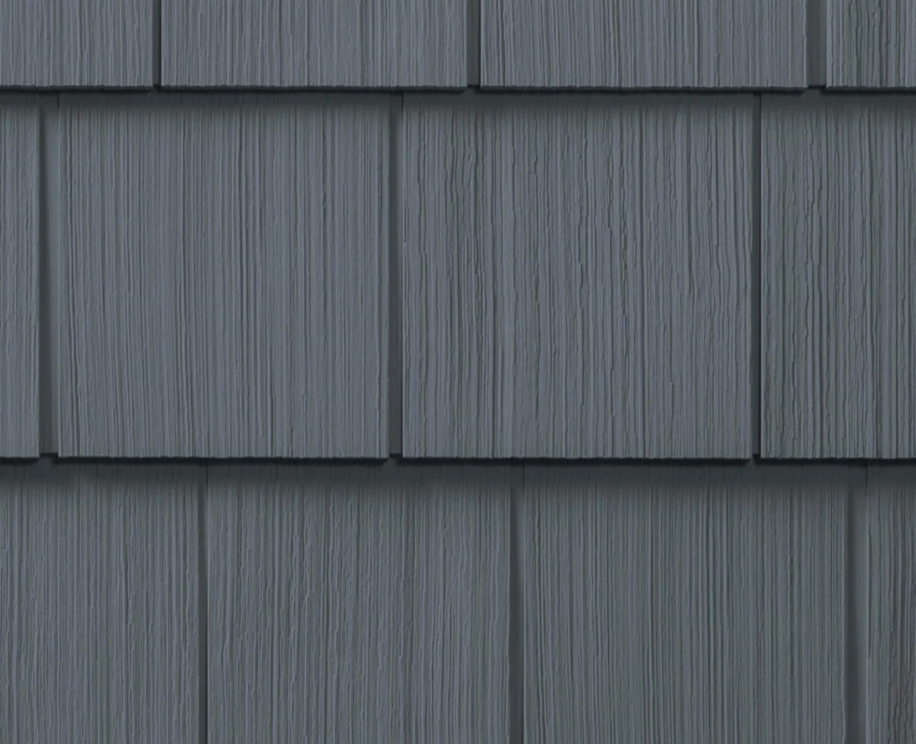 Dark Gray Roof Shingles Close-up Dark gray roof shingles with vertical lines. Close-up view.