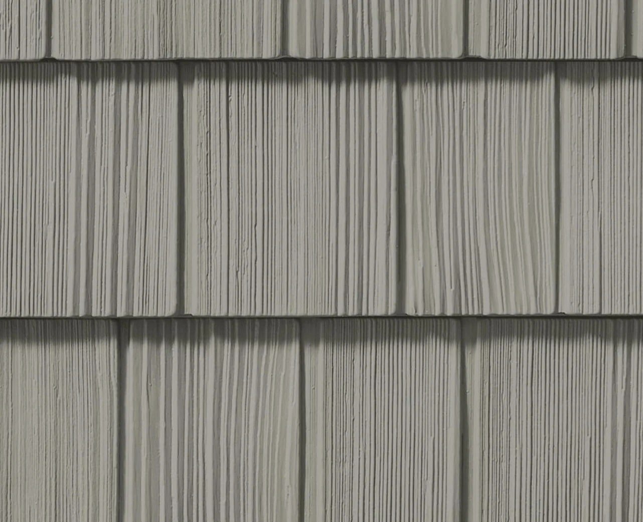 Gray shingles with wood grain texture. Roofing material.