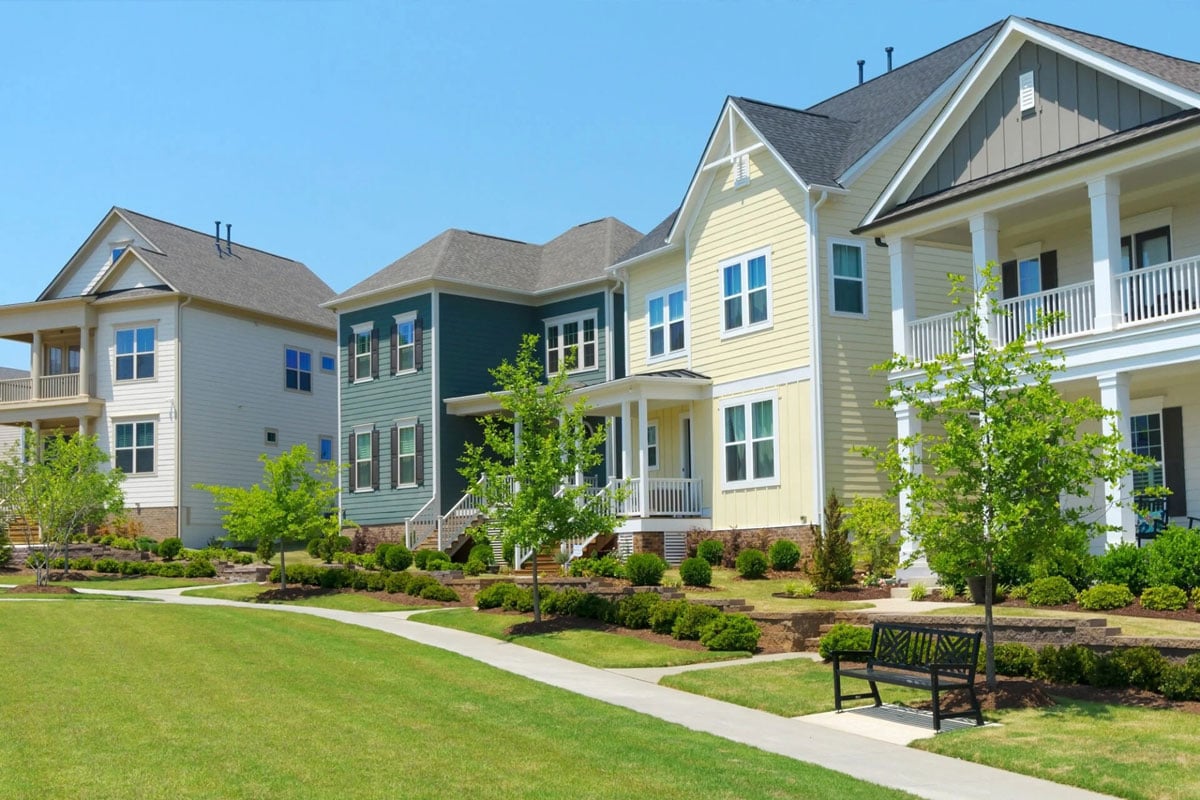 Luxury apartment buildings with green lawn and walkway Luxury apartment buildings with green lawn. Modern residential complex.