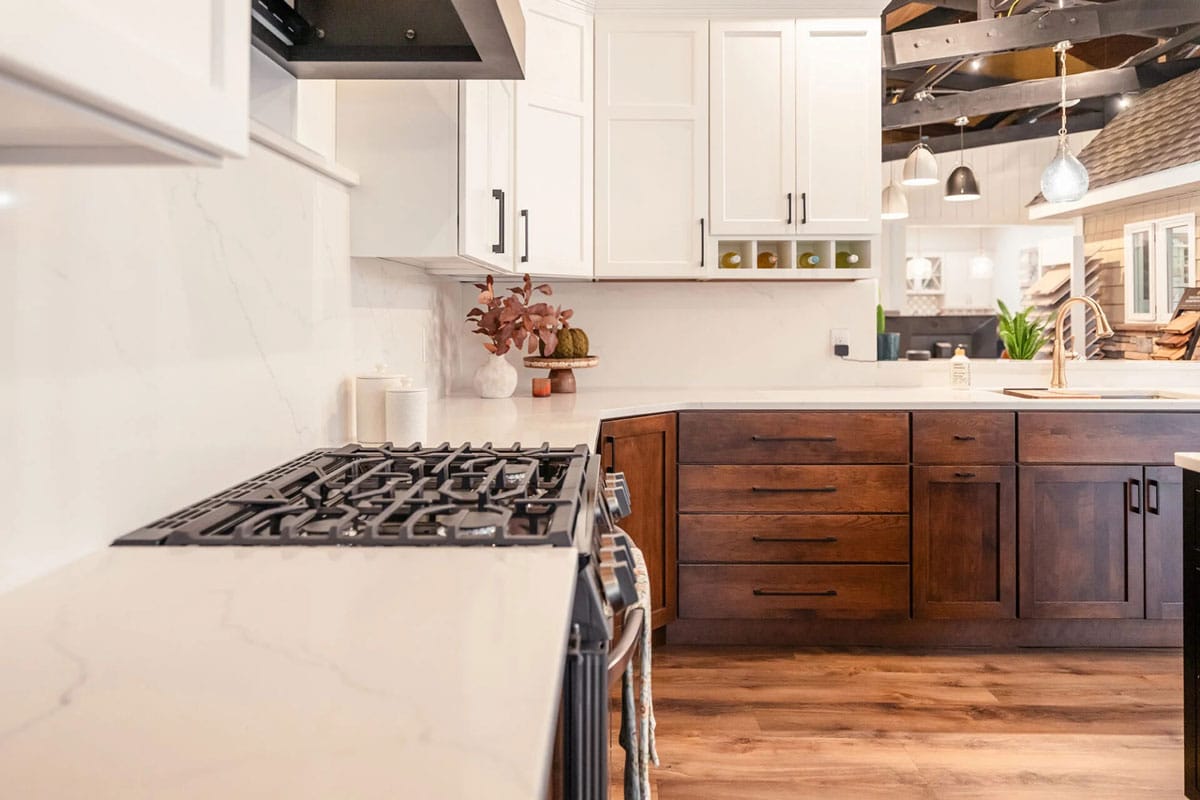 Modern kitchen interior with white marble countertops.