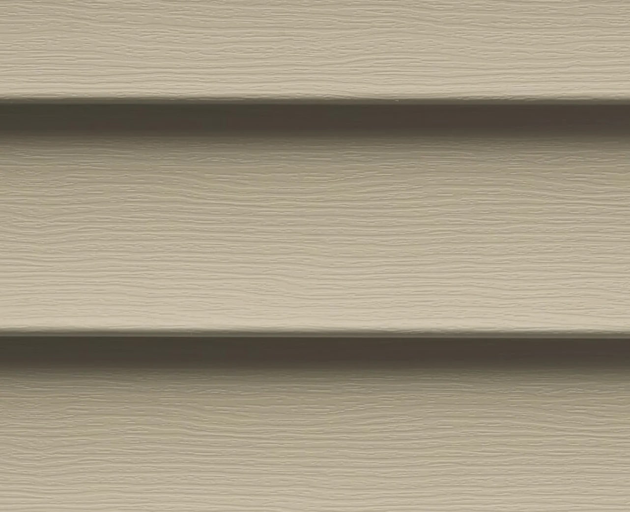 Tan siding panels. Exterior wall cladding.
