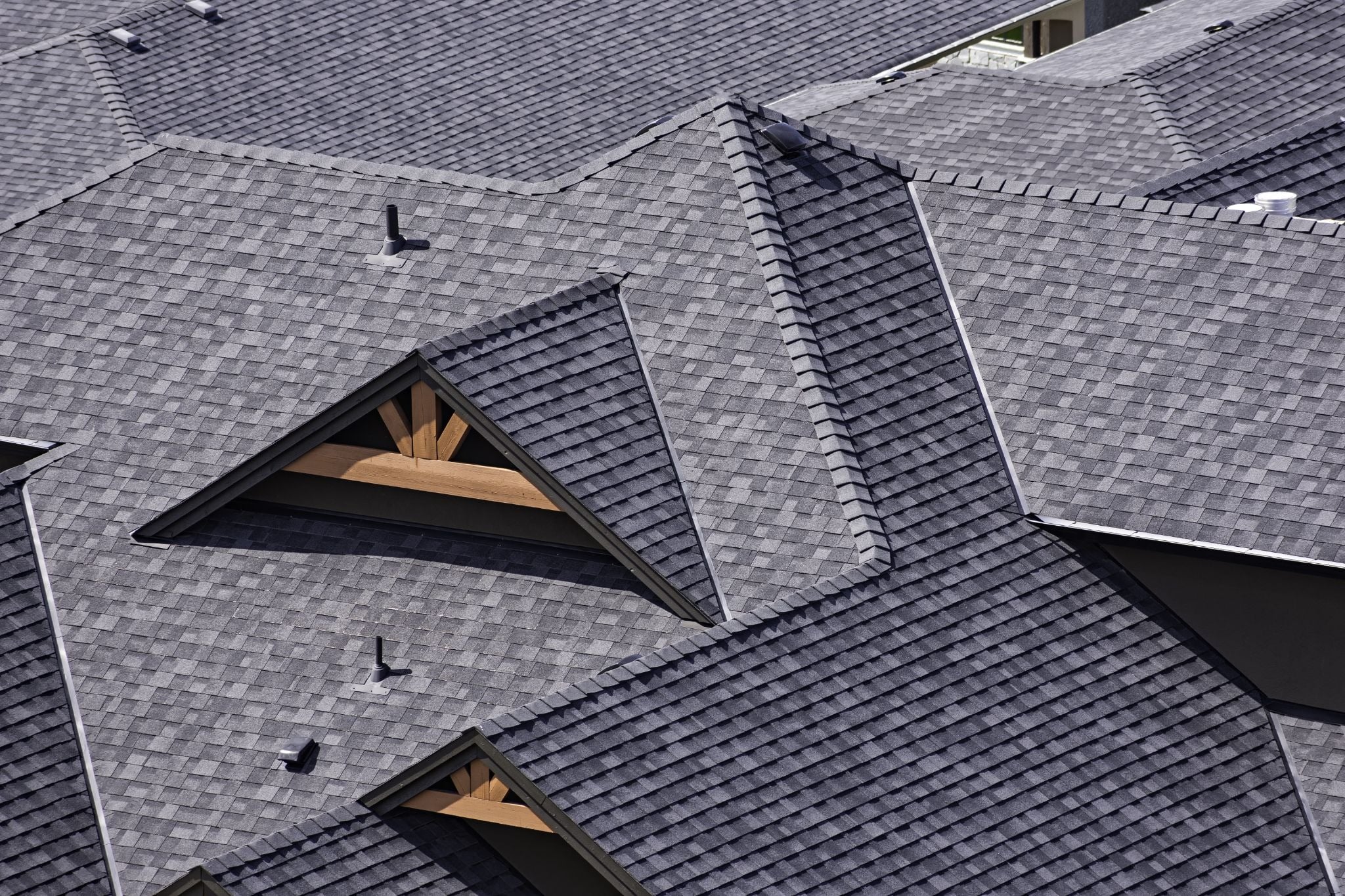 Roof with dormer windows. Three triangular roof sections.