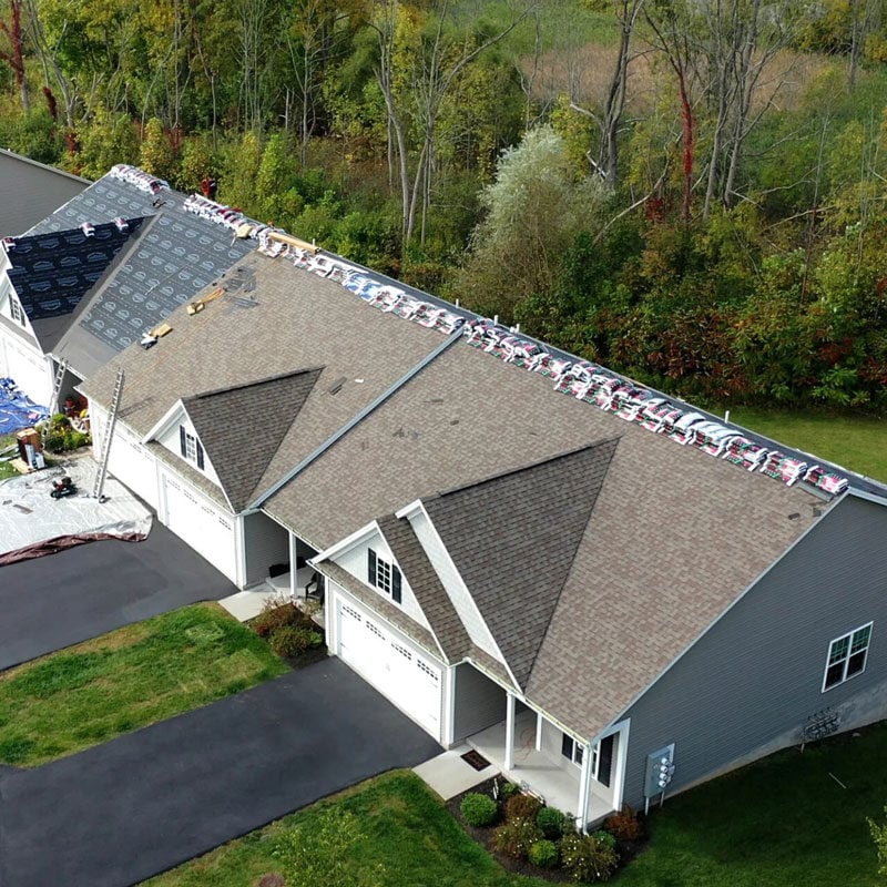 residential roofing installation process roofing installation on a house, workers on site