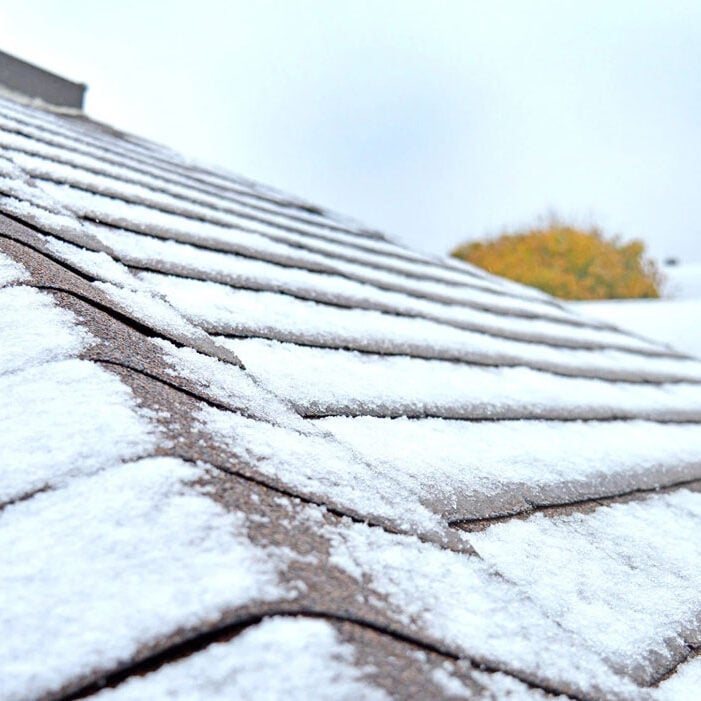 Snow covered roof tiles. Winter scene.