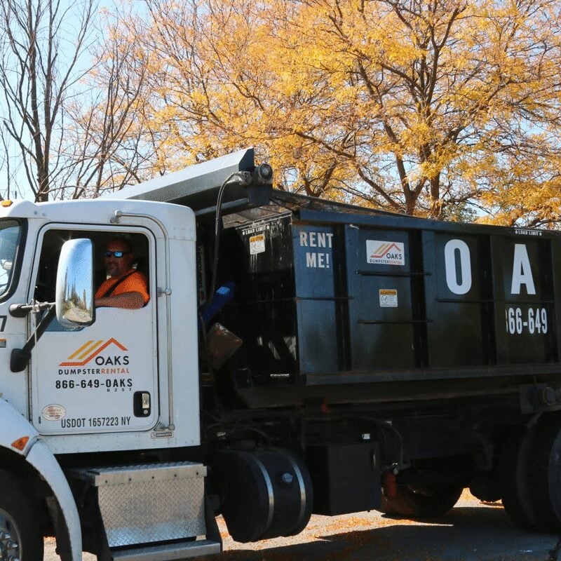 Old Oaks truck parked at night. The truck has a large tank.