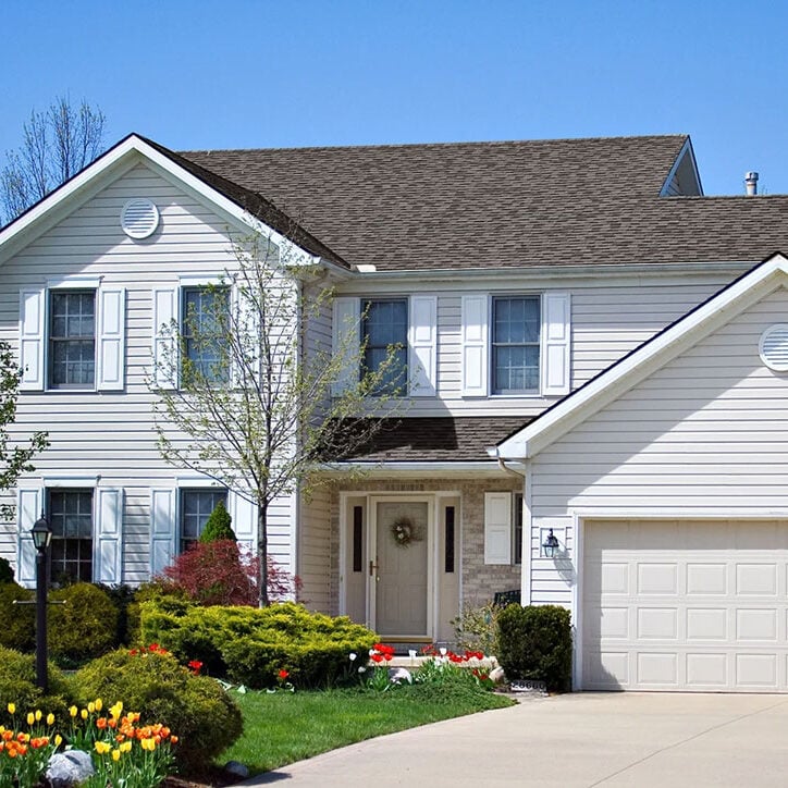 White Two Story House with Garage Beautiful white house with a garage.